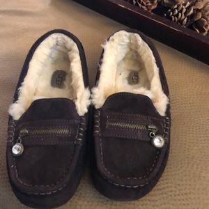 Brown Ugg moccasins fur lined with a jewel
